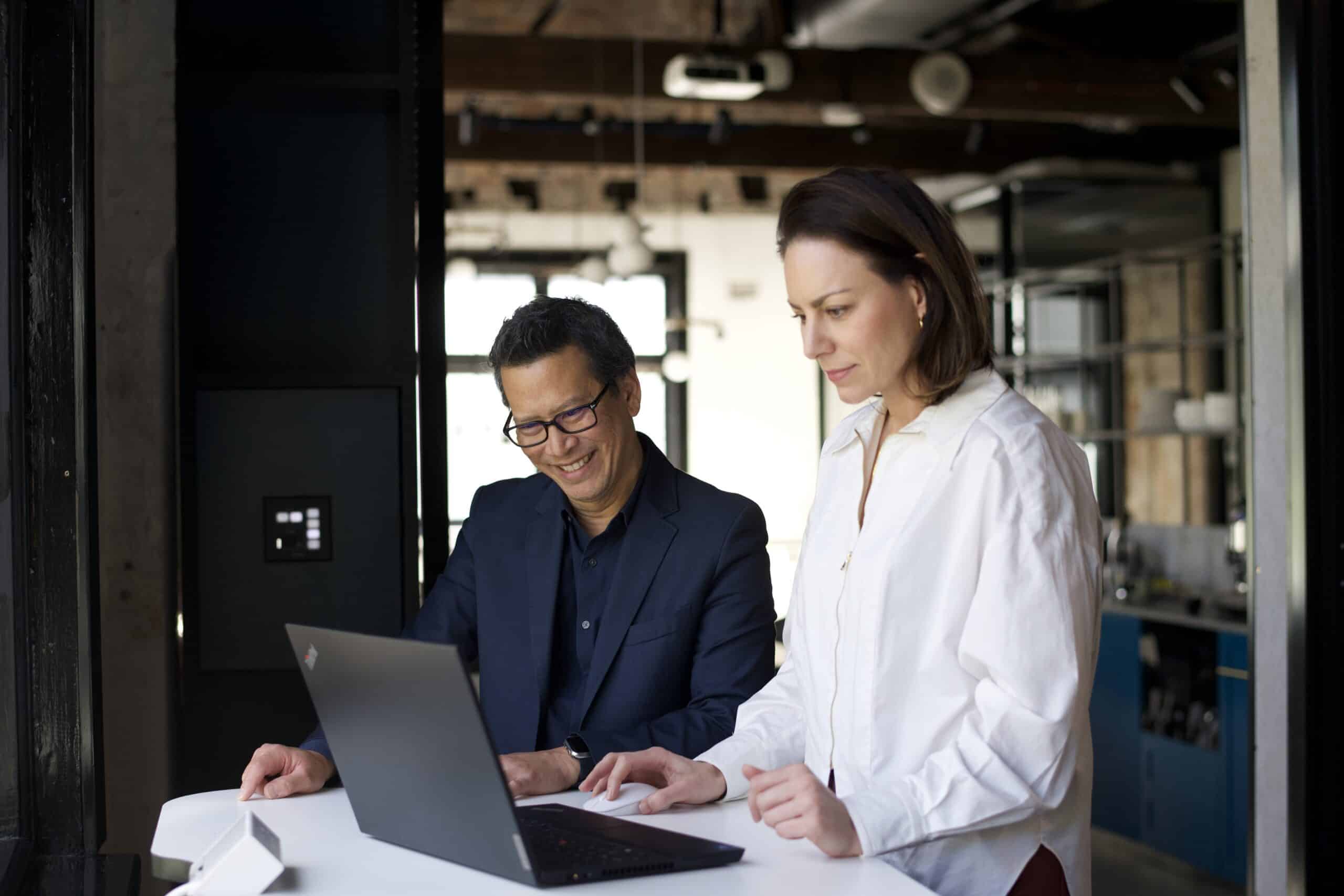 Two team members working together.