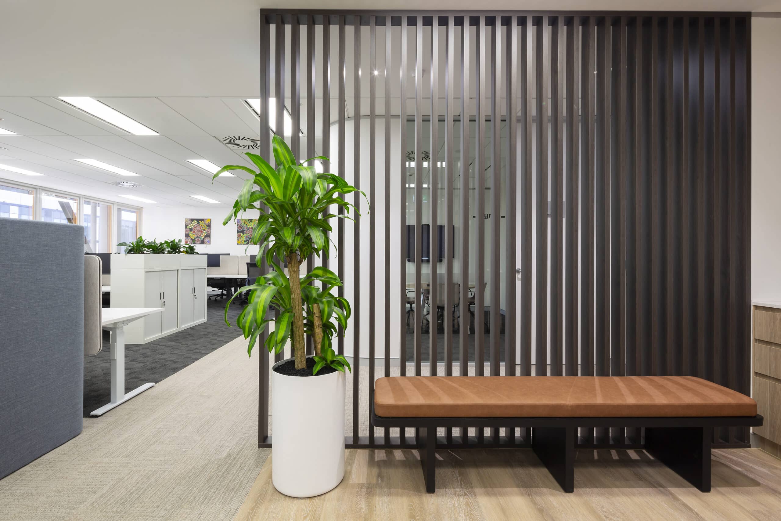 Stylish back-of-house area with organised shelving, workstations, and equipment in a well-lit, clean, and efficient workspace.