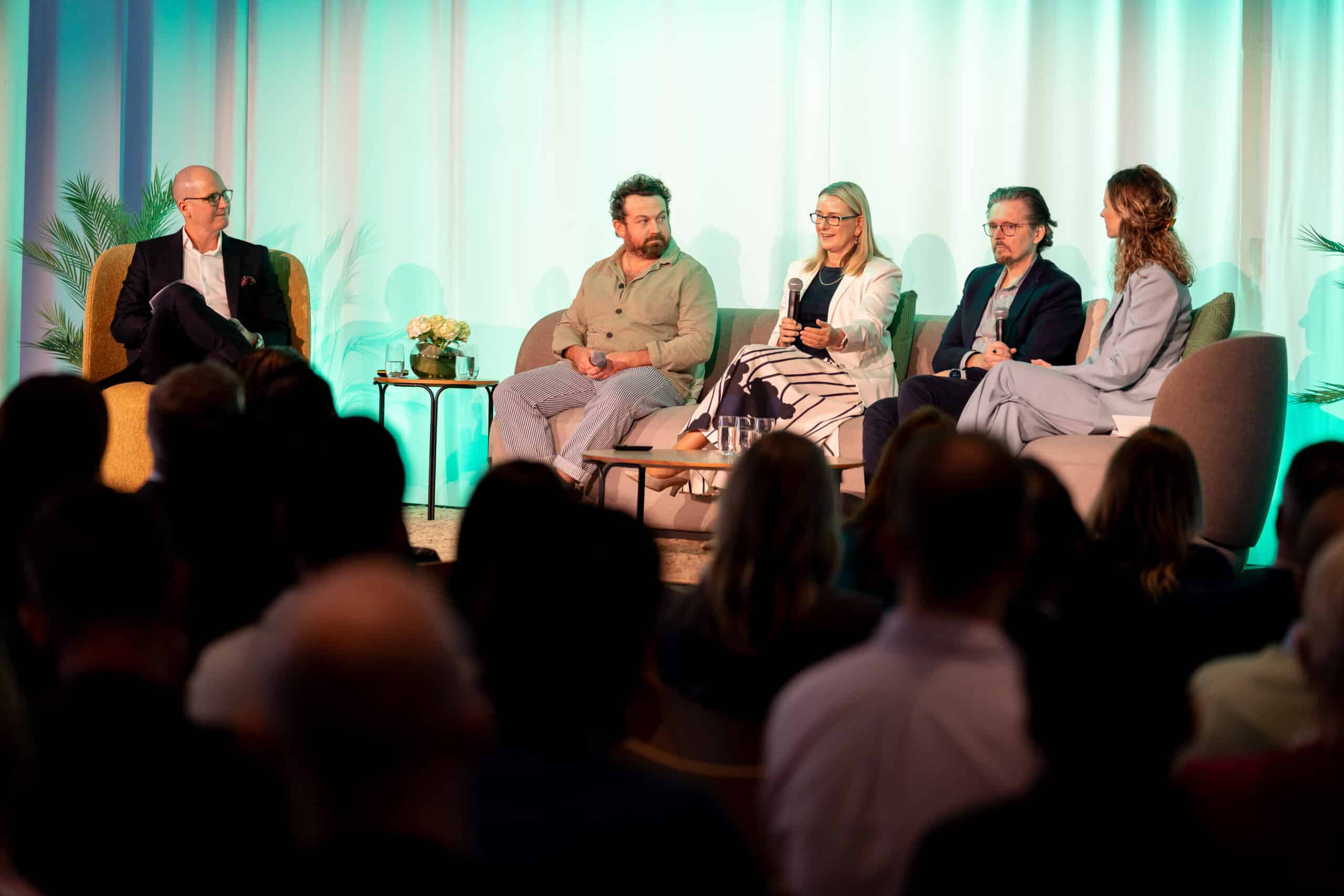 Rebecca Harrison speaking as a panelist at the 2025 Spaceful Workplace Summit